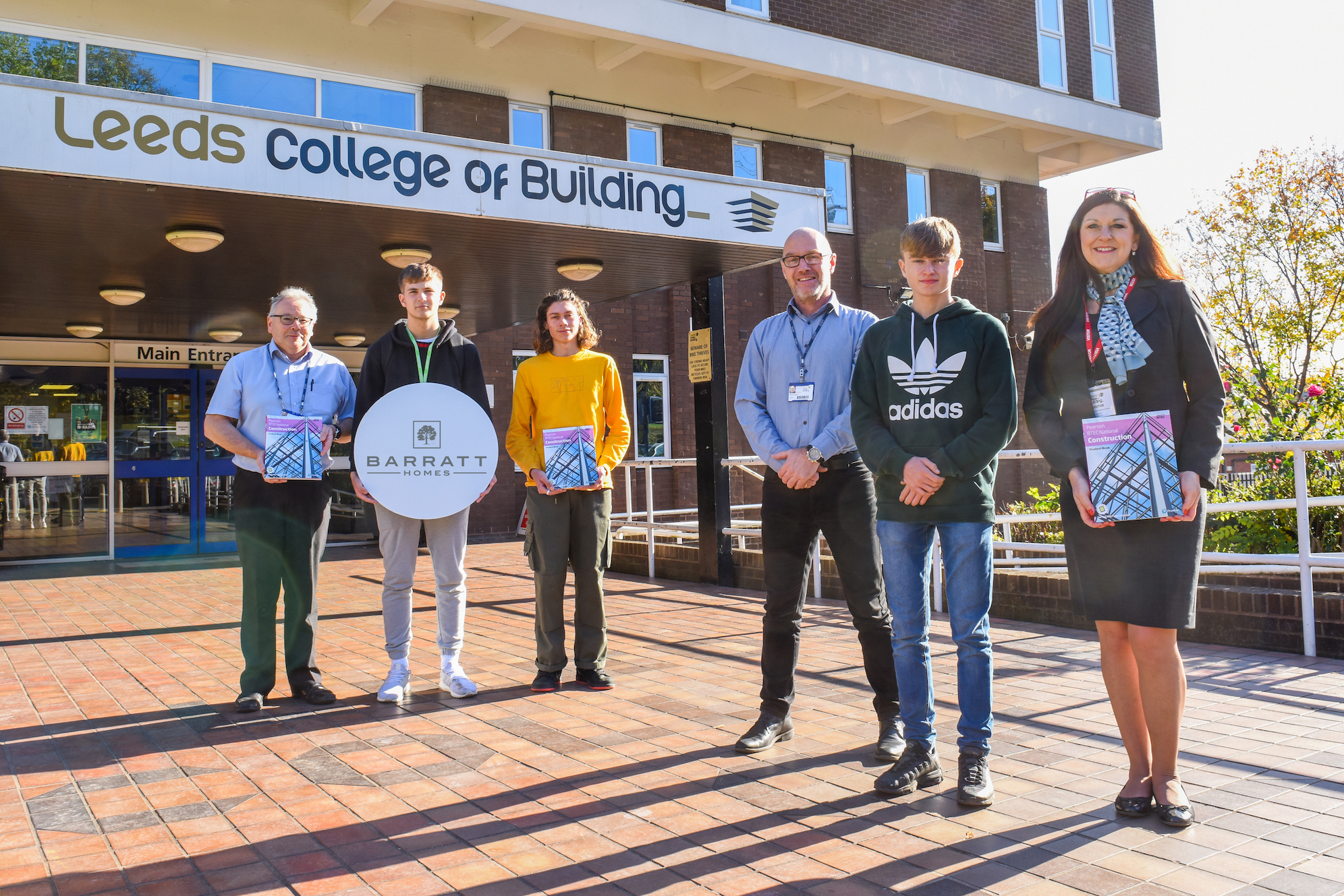 Sales Adviser Jenny Laslett with students and teachers from Leeds College of Building