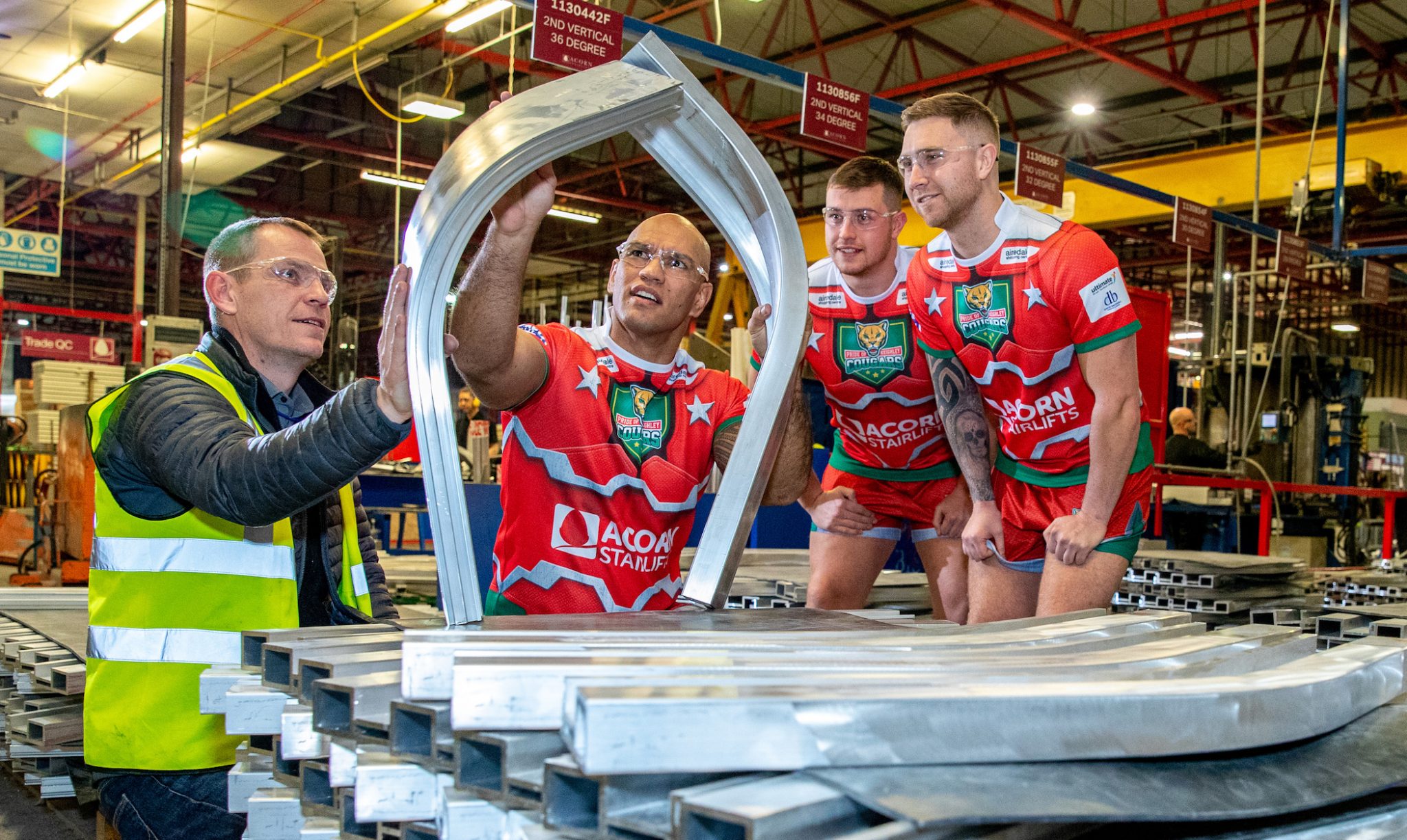 (2) Acorn manufacturing manager Andrew Longthorne with Keighley Cougars players Jake Webster, Dan Parker and Jordan Aitchison[4]