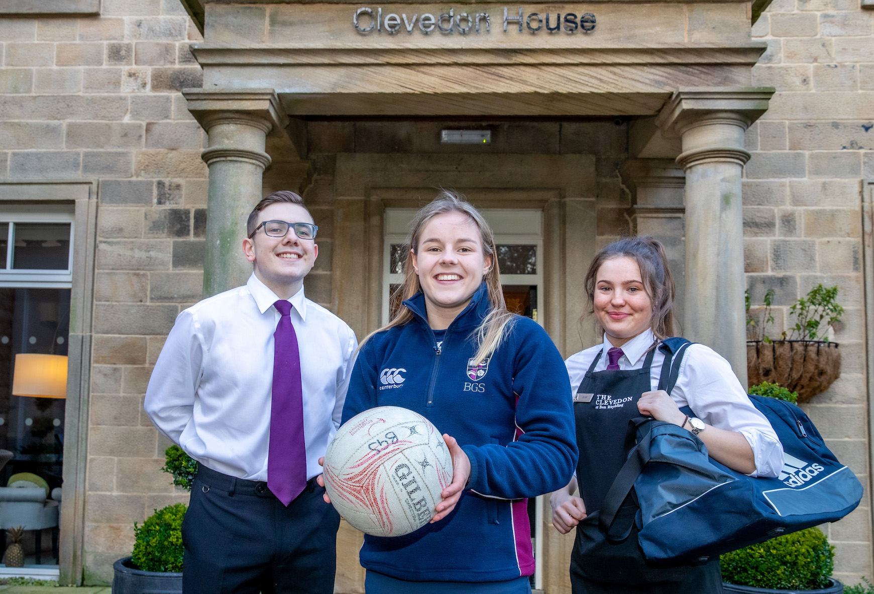 Grace Cogan from Bradford Grammar School, stood inbetween employees of Audley Clevedon, Jay Pattison and Elise Crabtree