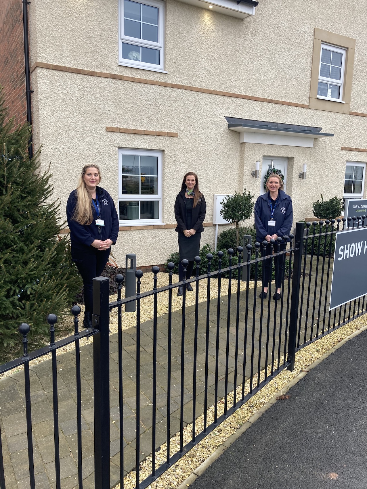 Community support - Katherine Read Clerical Assistant left and Kay ONeill Head of Care right from St Annes School and Sixth Form College with Barratt Homes sales advisor Sam Evers centre-2750b3da