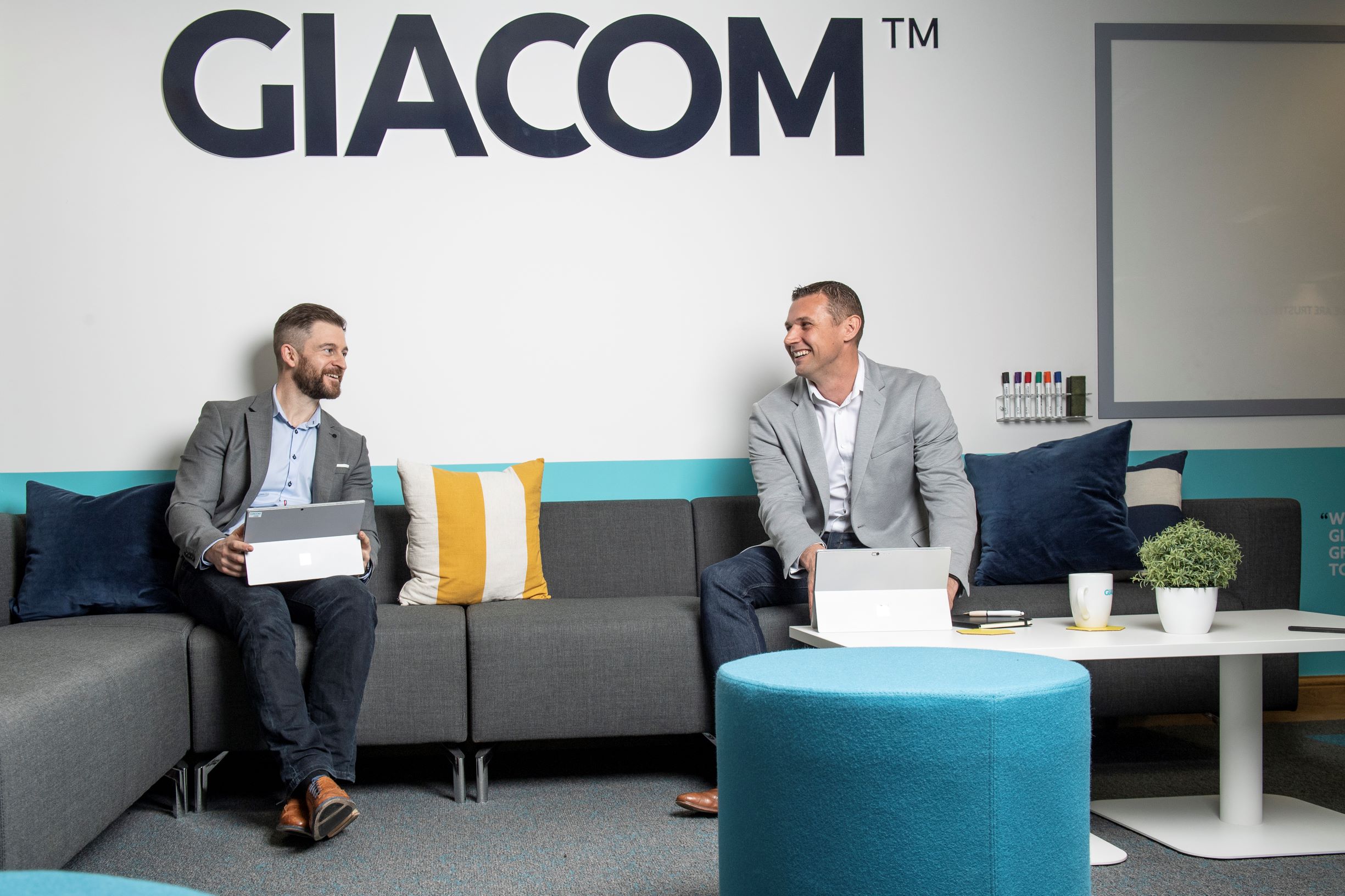 Mark Harding of Contrac and Mike Wardell of Giacom. The two companies have entered into an exclusive partnership-960bbbc6
