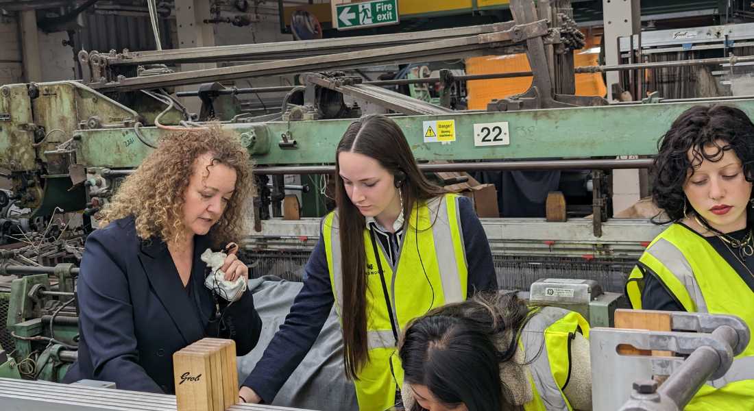 Andrea Noble, Design and Product Development Manager, with MMU students in Weaving Department