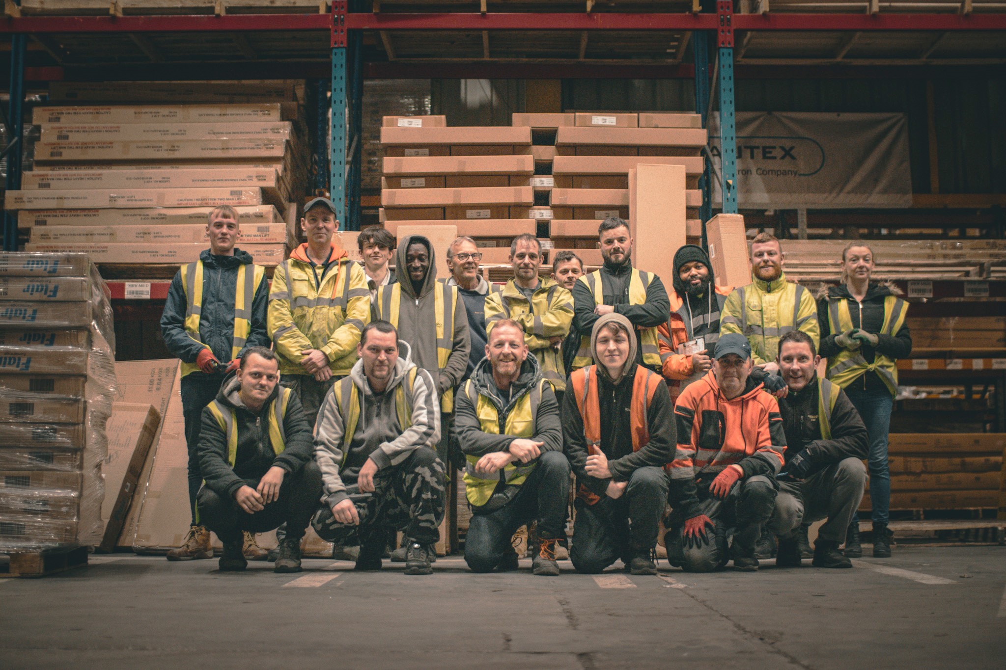Some of the Flair Furniture and Bed Kingdom team in the warehouse