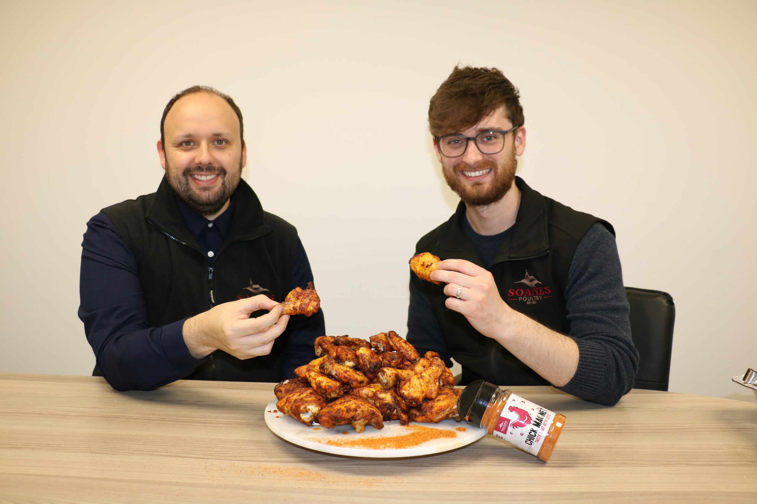 Ben Lee and Robert Laird enjoying the Chick Magnet coated chicken